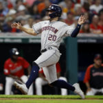 
              Houston Astros' Chas McCormick scores on a double by Martin Maldonado during the fifth inning of the team's baseball game against the Cleveland Guardians, Thursday, Aug. 4, 2022, in Cleveland. (AP Photo/Ron Schwane)
            