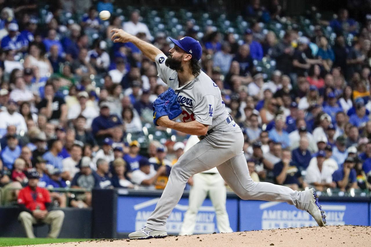 Los Angeles Dodgers starting pitcher Tony Gonsolin throws during the first inning of a baseball gam...