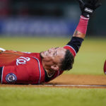 
              Washington Nationals' Ildemaro Vargas is safe at third on a fielding error during the fifth inning of a baseball game against the Oakland Athletics at Nationals Park, Wednesday, Aug. 31, 2022, in Washington. (AP Photo/Alex Brandon)
            
