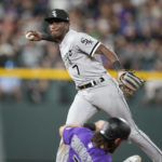
              Chicago White Sox shortstop Tim Anderson, back, forces out Colorado Rockies' Brendan Rodgers at second base on the front end of a double play hit into by Ryan McMahon to end the sixth inning of a baseball game Tuesday, July 26, 2022, in Denver. (AP Photo/David Zalubowski)
            