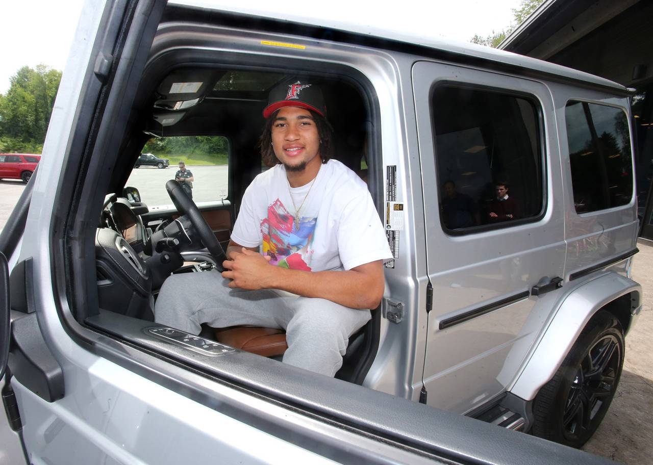Ohio State quarterback C.J. Stroud sits in the drivers seat after he received a 2019 Mercedes G-Wag...
