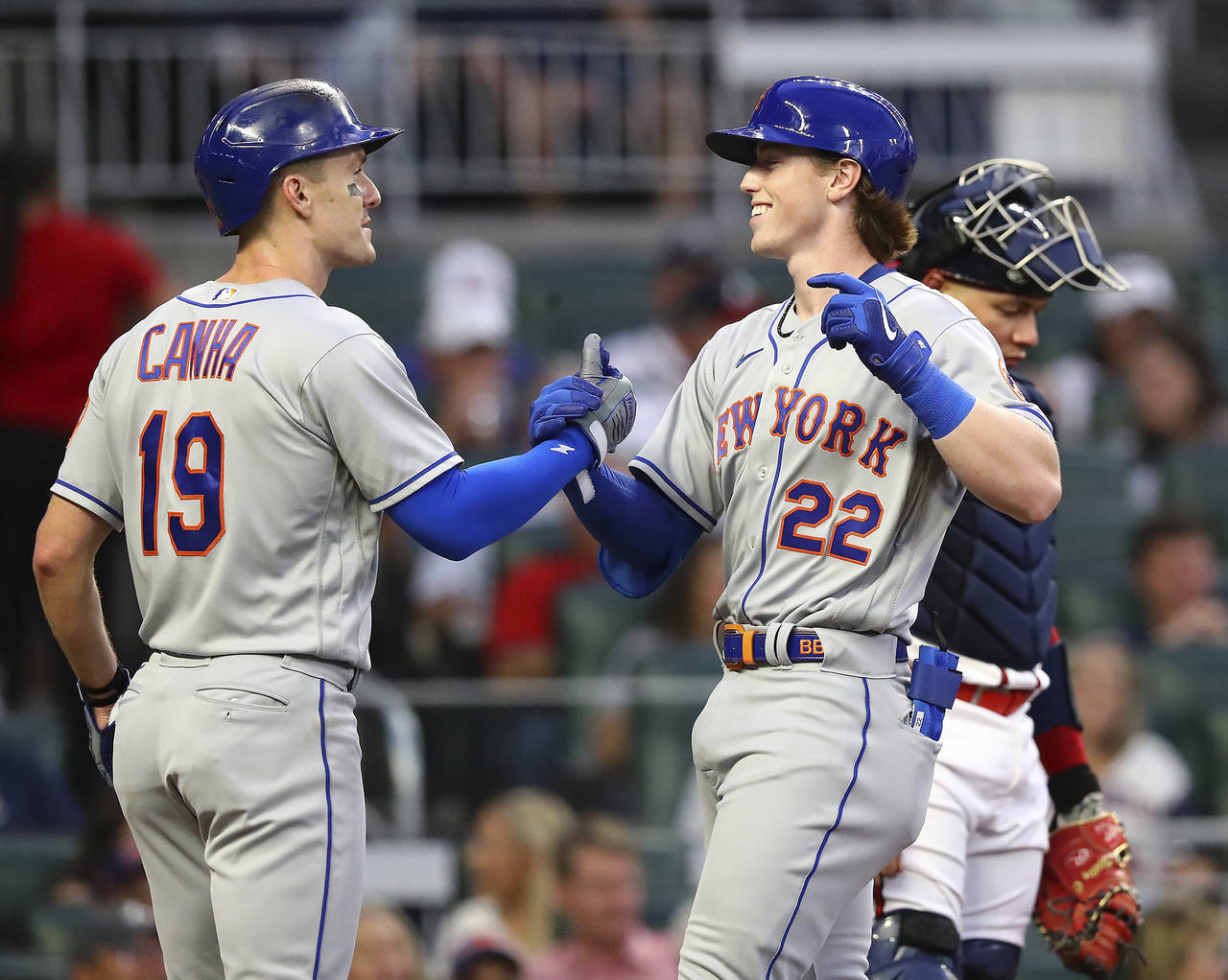 New York Mets' Brett Baty, right, is congratulated by Mark Canha for a two-run home run against the...