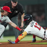 
              Atlanta Braves' Ronald Acuna Jr. (13) is tagged out at second base by Philadelphia Phillies second baseman Bryson Stott (5) as he tries to stretch a single in the fourth inning of a baseball game Tuesday, Aug. 2, 2022, in Atlanta. (AP Photo/John Bazemore)
            