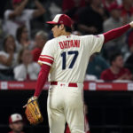 
              Los Angeles Angels starting pitcher Shohei Ohtani reacts after Oakland Athletics' Vimael Machin was thrown out at third base after a single by Tony Kemp during the fifth inning of a baseball game Wednesday, Aug. 3, 2022, in Anaheim, Calif. (AP Photo/Marcio Jose Sanchez)
            