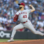 
              Los Angeles Angels starter Patrick Sandoval throws to a Seattle Mariners batter during the first inning of a baseball game Friday, Aug. 5, 2022, in Seattle. (AP Photo/Stephen Brashear)
            