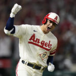 
              Los Angeles Angels designated hitter Shohei Ohtani (17) reacts as he runs the bases after hitting a home run during the sixth inning of a baseball game against the New York Yankees in Anaheim, Calif., Wednesday, Aug. 31, 2022. David Fletcher and Mike Trout also scored. (AP Photo/Ashley Landis)
            