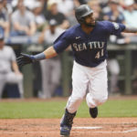 
              Seattle Mariners' Carlos Santana tosses his bat after hitting a two-run home run against the New York Yankees during the seventh inning of a baseball game, Wednesday, Aug. 10, 2022, in Seattle. (AP Photo/Ted S. Warren)
            