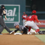 
              Washington Nationals' Ildemaro Vargas, center, is called out stealing second base as Cincinnati Reds second baseman Jonathan India (6) makes the tag during the second inning of a baseball game, Saturday, Aug. 27, 2022, in Washington. (AP Photo/Luis M. Alvarez)
            