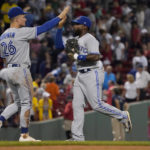 
              Toronto Blue Jays Jackie Bradley Jr., right, and Matt Chapman (26) celebrate after defeating the Boston Red Sox during the tenth inning of a baseball game at Fenway Park, Wednesday, Aug. 24, 2022, in Boston. (AP Photo/Mary Schwalm)
            