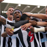 
              Newcastle United's Callum Wilson celebrates with his teammates after scoring their side's second goal of the game during the English Premier League soccer match against Manchester City at St. James' Park, Newcastle, England, Sunday, Aug. 21, 2022. (Owen Humphreys/PA via AP)
            