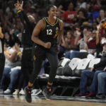 
              Las Vegas Aces guard Chelsea Gray (12) celebrates after making a 3-point shot against the Phoenix Mercury during the second half in Game 2 of a WNBA basketball first-round playoff series Saturday, Aug. 20, 2022, in Las Vegas. (AP Photo/John Locher)
            