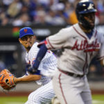
              New York Mets starting pitcher Carlos Carrasco throws out Atlanta Braves' Michael Harris II at first base during the third inning of a baseball game, Thursday, Aug. 4, 2022, in New York. (AP Photo/Frank Franklin II)
            