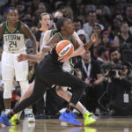 
              Las Vegas Aces guard Chelsea Gray is fouled by Seattle Storm forward Breanna Stewart, behind, during the second half of a WNBA basketball game, Sunday, Aug. 14, 2022, in Las Vegas. (AP Photo/Sam Morris)
            
