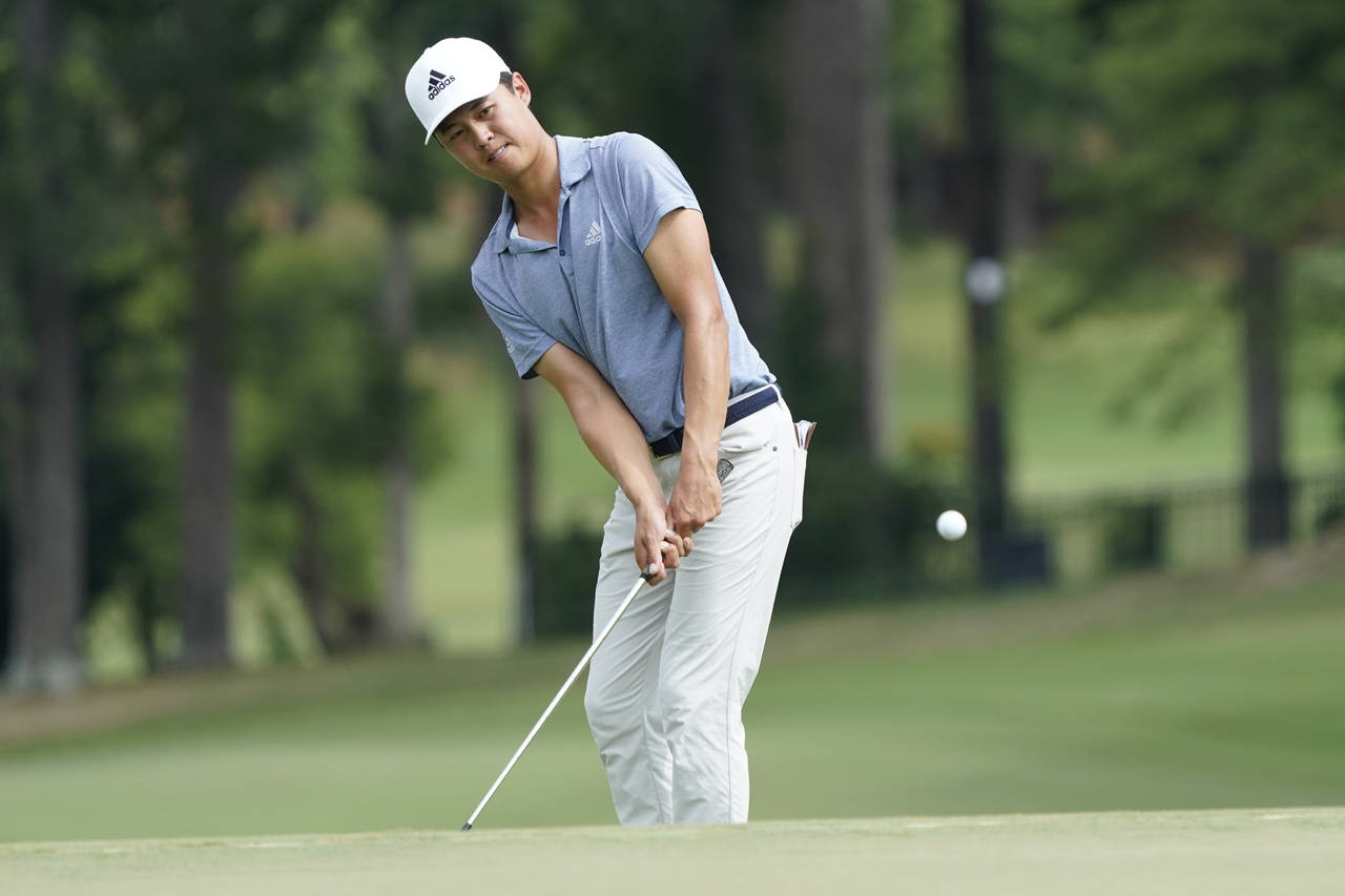 Brandon Wu chips to the ninth hole during the third round of the Wyndham Championship golf tourname...