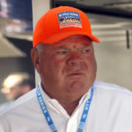 
              FILE - Car owner Chip Ganassi is seen in the paddock before an IndyCar race at Mid-Ohio Sports Car Course in Lexington, Ohio, Sunday, July 4, 2021. The conversation might not have even lasted 10 seconds. It was more of an exchange, really, but whatever Chip Ganassi said to Alex Palou after Sunday's, Aug. 7, 2022, race in Nashville was their first direct conversation since the reigning IndyCar champion said he was leaving the team. There's three races left in the season, Palou is in the thick of the title hunt and Ganassi is suing him. (AP Photo/Tom E. Puskar, File)
            