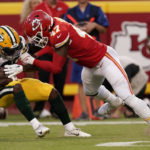 
              Green Bay Packers running back Tyler Goodson (39) is stopped by Kansas City Chiefs linebacker Darius Harris (47) during the first half of an NFL preseason football game Thursday, Aug. 25, 2022, in Kansas City, Mo. (AP Photo/Charlie Riedel)
            