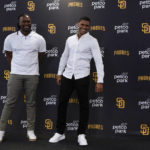 
              San Diego Padres outfielder Juan Soto, right, jokes with first baseman Josh Bell during a news conference at Petco Park Wednesday, Aug. 3, 2022, in San Diego. Soto, the generational superstar whose trade-deadline acquisition instantly made the Padres a strong playoff contender, was introduced at a news conference Wednesday along with fellow newcomer Josh Bell. (AP Photo/Gregory Bull)
            