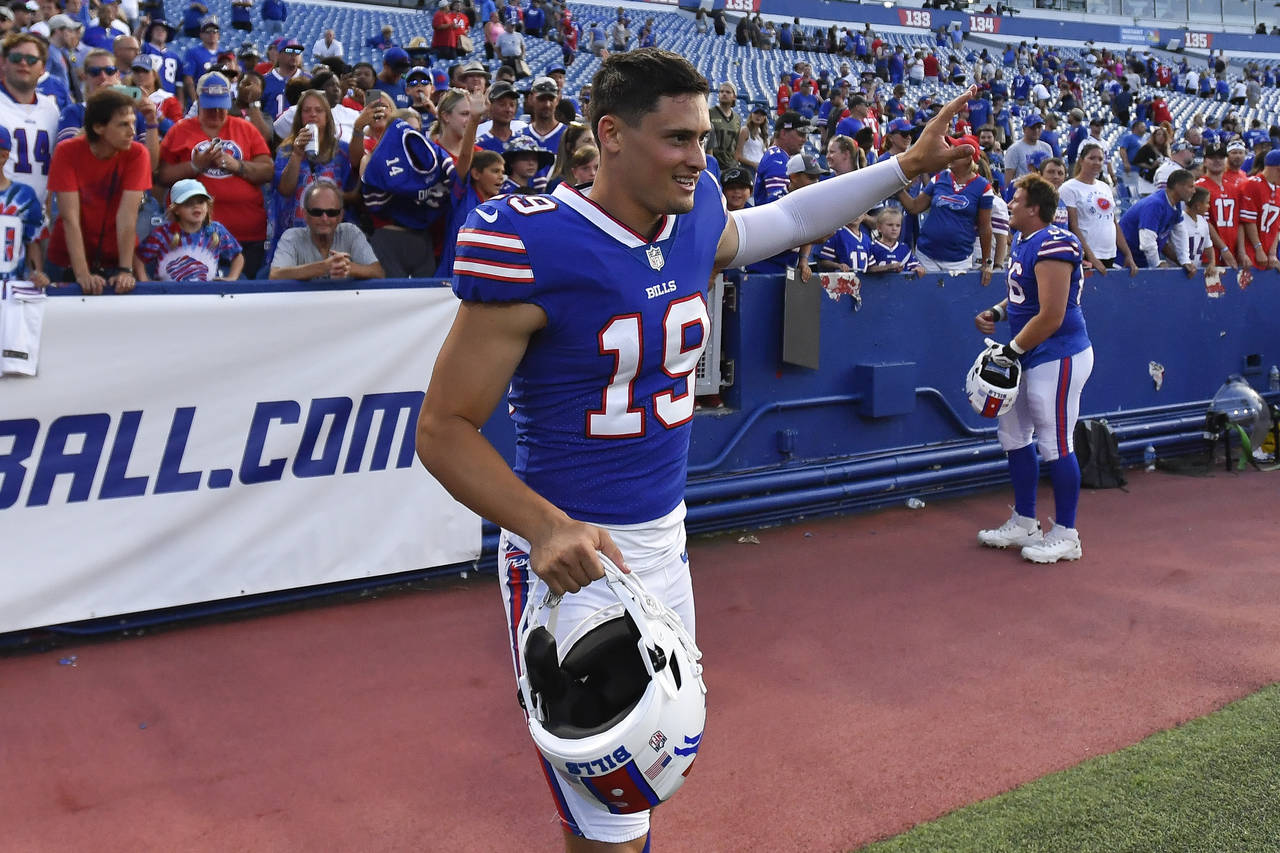 FILE - Buffalo Bills punter Matt Araiza waves to fans after a preseason NFL football game against t...