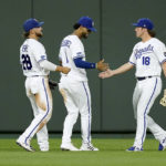 
              Kansas City Royals' Kyle Isbel (28), MJ Melendez (1) and Nate Eaton (18) celebrate after their baseball game against the Chicago White Sox Wednesday, Aug. 10, 2022, in Kansas City, Mo. The Royals won 8-3. (AP Photo/Charlie Riedel)
            