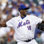
              Former New York Mets pitcher Dwight Gooden throws during an Old-Timers' game before a baseball game between the Colorado Rockies and the New York Mets on Saturday, Aug. 27, 2022, in New York. (AP Photo/Adam Hunger)
            