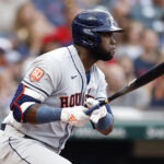 
              Houston Astros' Yordan Alvarez watches his RBI single off Cleveland Guardians starting pitcher Hunter Gaddis during the third inning of a baseball game, Friday, Aug. 5, 2022, in Cleveland. (AP Photo/Ron Schwane)
            