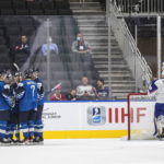 
              Finland celebrates a goal against Slovakia's goalie Tomas Bolo (1) during third-period IIHF world junior hockey championship game action in Edmonton, Alberta, Sunday, Aug. 14, 2022. (Jason Franson/The Canadian Press via AP)
            