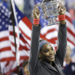 
              FILE - Serena Williams holds up the championship trophy after defeating Victoria Azarenka, of Belarus, during the women's singles final of the 2013 U.S. Open tennis tournament, Sunday, Sept. 8, 2013, in New York. Saying “the countdown has begun,” 23-time Grand Slam champion Serena Williams announced Tuesday, Aug. 9, 2022, she is ready to step away from tennis so she can turn her focus to having another child and her business interests, presaging the end of a career that transcended sports. (AP Photo/David Goldman, File)
            