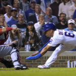 
              Washington Nationals catcher Keibert Ruiz tags out Chicago Cubs' Rafael Ortega during the seventh inning of a baseball game Tuesday, Aug. 9, 2022, in Chicago. (AP Photo/Charles Rex Arbogast)
            
