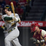 
              Oakland Athletics' Sean Murphy follows through on his RBI single during the fifth inning of a baseball game against the Los Angeles Angels Tuesday, Aug. 2, 2022, in Anaheim, Calif. (AP Photo/Marcio Jose Sanchez)
            
