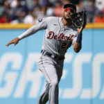 
              Detroit Tigers right fielder Victor Reyes makes a running catch for the out on Cleveland Guardians' Amed Rosario during the third inning in the first baseball game of a doubleheader, Monday, Aug. 15, 2022, in Cleveland. (AP Photo/Ron Schwane)
            