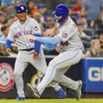 
              New York Mets third base coach Joey Cora, left, yells to New York Mets' Pete Alonso as runs to home plate to score on a Jeff McNeil double during the sixth inning of a baseball game Tuesday, Aug. 23, 2022, in New York. (AP Photo/Frank Franklin II)
            
