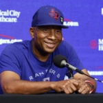 
              Texas Rangers third base coach Tony Beasley smiles as he listens to a question during a news conference after being announced as interim manager of the baseball team, in Arlington, Texas, Monday, Aug. 15, 2022. The Rangers fired manager Chris Woodward on Monday. (Elías Valverde II/The Dallas Morning News via AP)
            