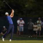 
              Jordan Spieth watches his shot from the fairway on the 12th hole during the second round of the BMW Championship golf tournament at Wilmington Country Club, Friday, Aug. 19, 2022, in Wilmington, Del. (AP Photo/Julio Cortez)
            