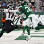 
              Atlanta Falcons wide receiver Olamide Zaccheaus (17) runs in a touchdown against New York Jets cornerback Bryce Hall (37) during the first half of an NFL football game, Monday, Aug. 22, 2022, in East Rutherford, N.J. (AP Photo/Julia Nikhinson)
            