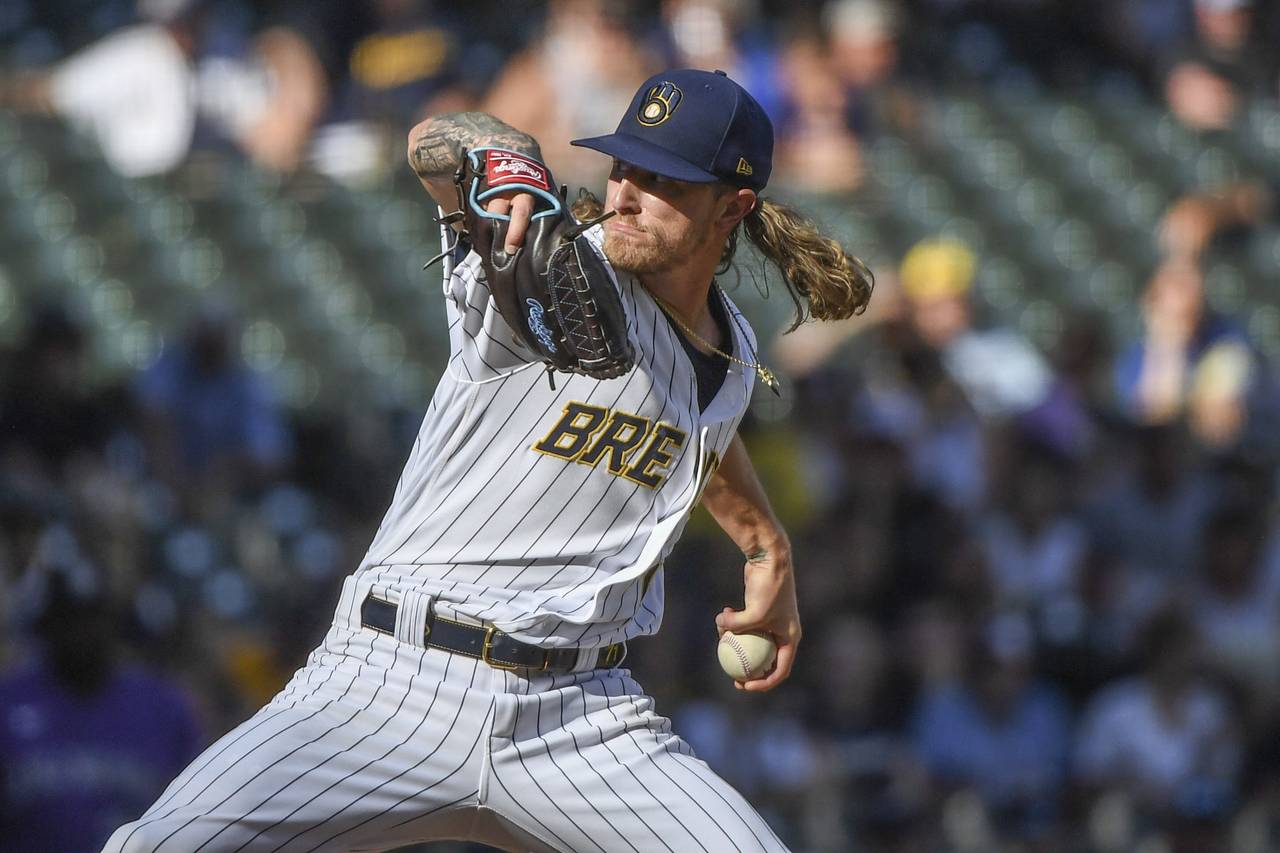Milwaukee Brewers' Josh Hader pitches during the ninth inning of a baseball game against the Colora...