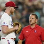 
              Texas Rangers starting pitcher Jon Gray talks with head athletic trainer Matt Lucero, right, in the second inning of a baseball game against the Baltimore Orioles, Monday, Aug. 1, 2022, in Arlington, Texas. Gray left the game with an unknown injury. (AP Photo/Tony Gutierrez)
            