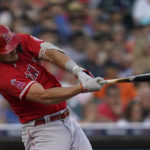 
              Los Angeles Angels' Mike Trout singles against the Detroit Tigers in the third inning of a baseball game in Detroit, Friday, Aug. 19, 2022. (AP Photo/Paul Sancya)
            