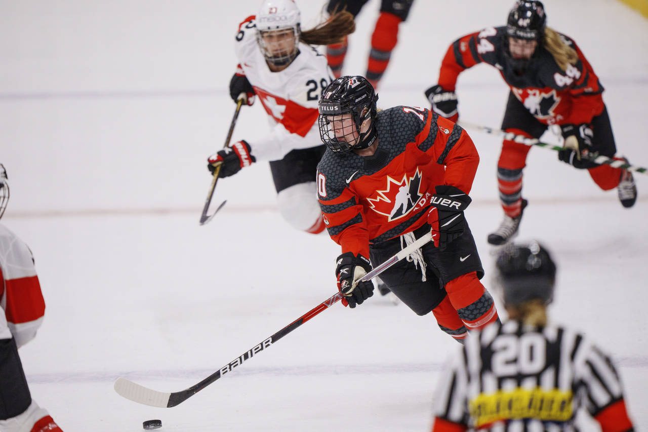 Sarah Fillier of Canada in action with Alina Marti of Switzerland during The IIHF World Championshi...