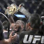 
              UFC fighter Leon Edwards, of Jamaica, celebrates his title as welterweight champion of the world after knocking out Nigerian UFC fighter Kamaru Usman during the UFC 278 mixed martial arts title bout in Salt Lake City on Saturday, Aug. 20, 2022. (Francisco Kjolseth/The Salt Lake Tribune via AP)
            