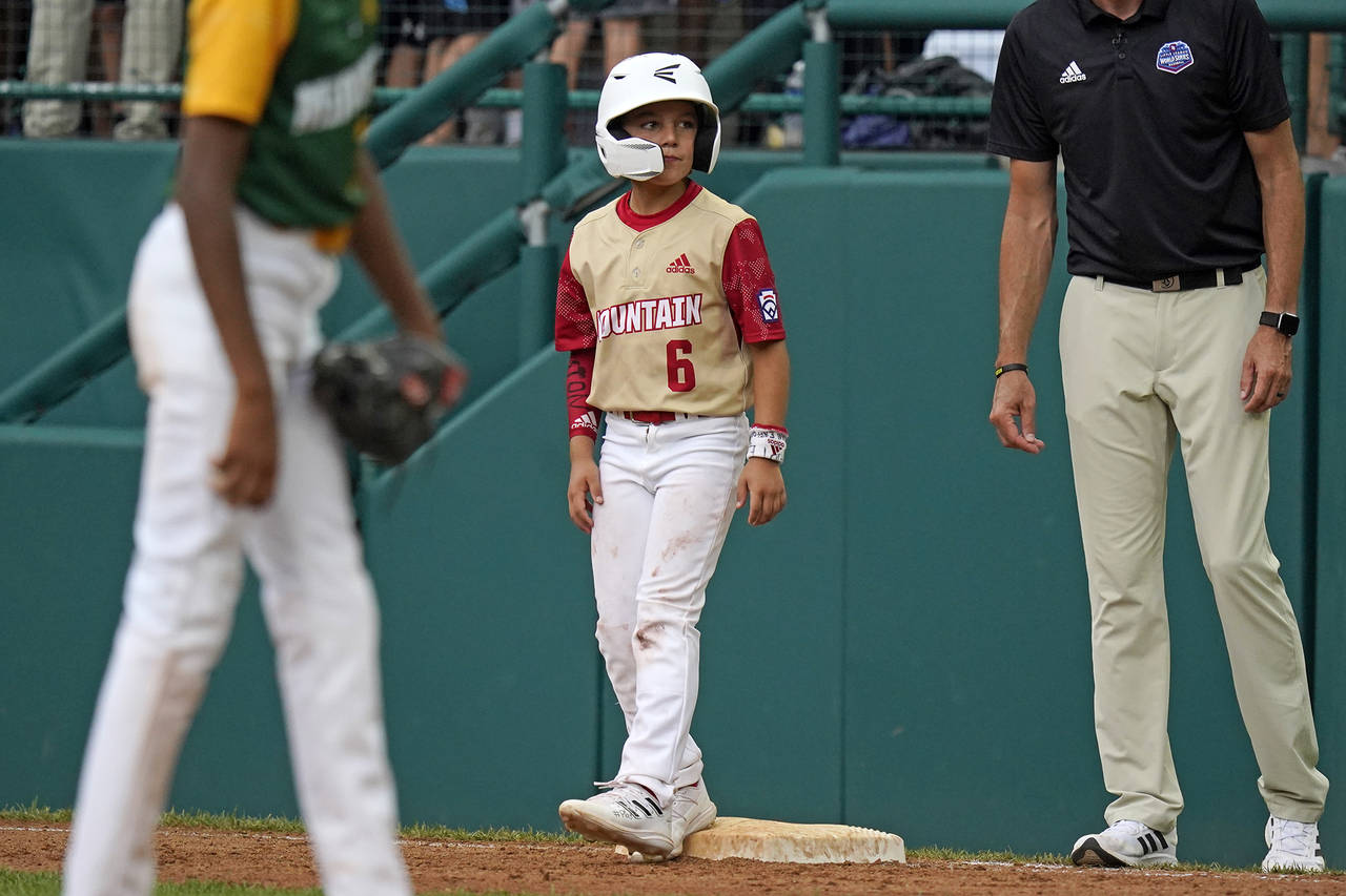 Santa Clara, Utah's Brogan Oliverson (6) stands on first base as a pinch runner during the fifth in...