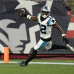 
              Carolina Panthers cornerback Tae Hayes runs into the end zone for a touchdown on an interception during the second half of the team's preseason NFL football game against the New England Patriots, Friday, Aug. 19, 2022, in Foxborough, Mass. (AP Photo/Charles Krupa)
            
