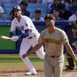 
              Los Angeles Dodgers' Cody Bellinger, left, runs to first as he hits a solo home run while San Diego Padres starting pitcher Yu Darvish, center, watches along with catcher Austin Nola during the third inning of a baseball game Sunday, Aug. 7, 2022, in Los Angeles. (AP Photo/Mark J. Terrill)
            