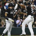 
              Chicago White Sox's Gavin Sheets (32) high-fives Jose Abreu (79), who scored against the Detroit Tigers during the seventh inning of a baseball game Saturday, Aug. 13, 2022, in Chicago. (AP Photo/Matt Marton)
            