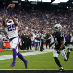 
              Minnesota Vikings wide receiver Albert Wilson catches a touchdown pass ahead of Las Vegas Raiders cornerback Bryce Cosby during the second half of an NFL preseason football game, Sunday, Aug. 14, 2022, in Las Vegas. (AP Photo/John Locher)
            