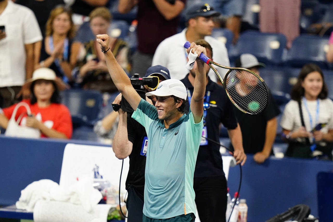 Brandon Holt, of the United States, reacts after defeating Taylor Fritz, of the United States, duri...