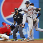 
              Detroit Tigers shortstop Javier Baez (28) reacts after forcing out Cleveland Guardians' Andres Gimenez at second base but not being able to throw out Myles Straw at first base during the fourth inning of a baseball game Wednesday, Aug. 17, 2022, in Cleveland. (AP Photo/Ron Schwane)
            