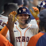 
              Houston Astros' Aledmys Diaz celebrates with teammates in the dugout after hitting a grand slam against the Texas Rangers during the fourth inning of a baseball game Tuesday, Aug. 9, 2022, in Houston. (AP Photo/David J. Phillip)
            