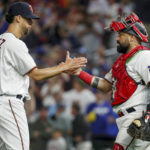 
              Minnesota Twins relief pitcher Jorge Lopez, left, celebrates a win over the Toronto Blue Jays with Sandy Leon, right, after a baseball game Saturday, Aug. 6, 2022, in Minneapolis. (AP Photo/Bruce Kluckhohn)
            