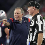 
              New England Patriots head coach Bill Belichick, left, speaks with line judge Daniel Gallagher (85) during the first half of the team's preseason NFL football game against the Carolina Panthers, Friday, Aug. 19, 2022, in Foxborough, Mass. (AP Photo/Michael Dwyer)
            