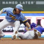 
              Milwaukee Brewers' Keston Hiura tags out Chicago Cubs' Nico Hoerner as he is caught stealing second during the second inning of a baseball game Friday, Aug. 26, 2022, in Milwaukee. (AP Photo/Morry Gash)
            